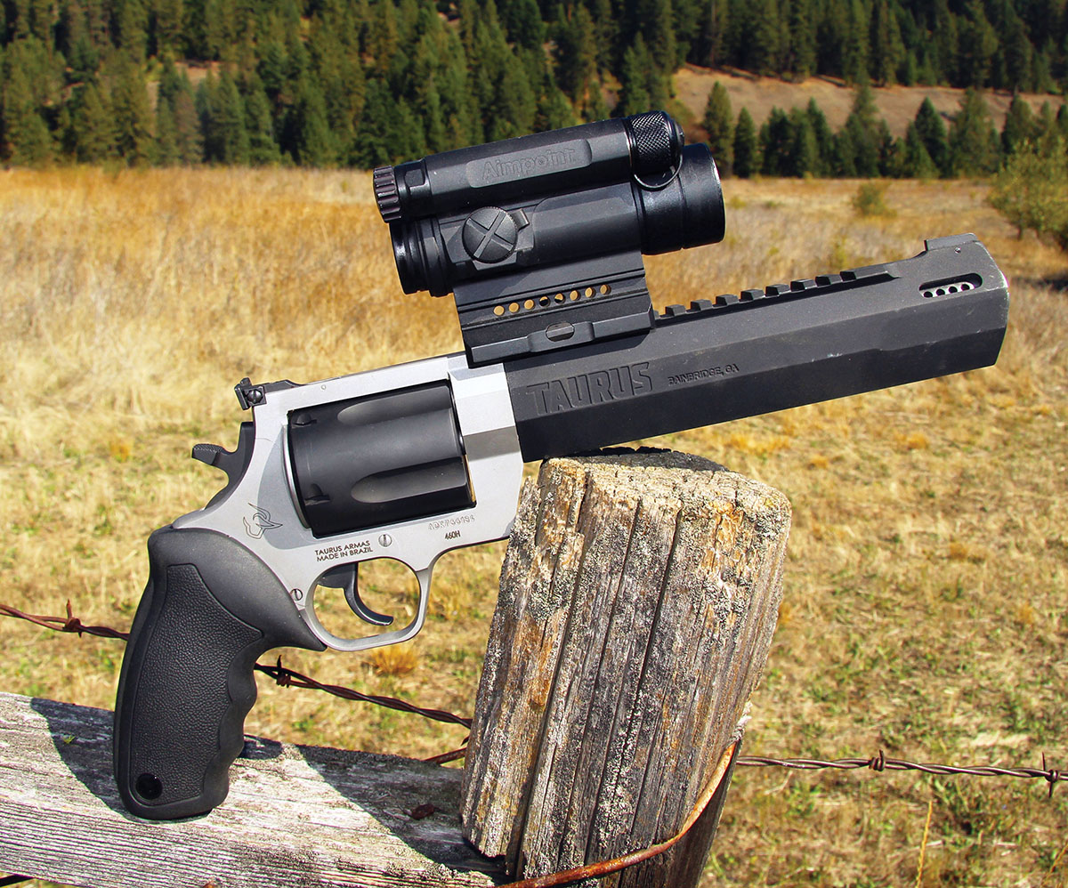 The Raging Hunter 460 S&W by Taurus was set up with a military grade Aimpoint CompM4 Red Dot Reflex Sight, QRP2 Mount and 2 MOA aiming dot. It proved up to the rigors of the intense cartridge.